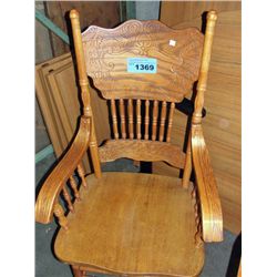 One oak pressed back dining room arm chair