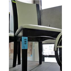 White leather padded dining room side chair