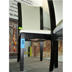 White leather padded dining room side chair