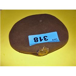 Beret with brass military pin
