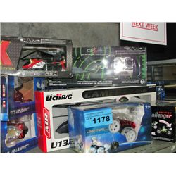 Shelf lot of radio controlled helicopters and cars