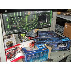 Shelf lot of radio controlled helicopters and cars