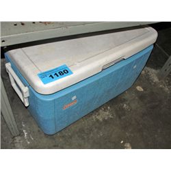 Coleman cooler filled with assorted camping