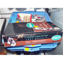 2 blue plastic baskets filled with assorted