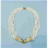 Image 1 : An unusual seed pearl necklace by Patek Phillip. 7 strands joined together by 2 detailed diamond and