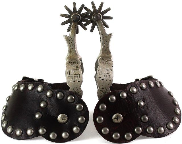Pair iron spurs with engraved rolling logs