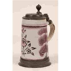 A Continental Late 17th/Early 18th Century Pottery Tankard, decorated in puce with flowers and tr...