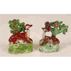 Two Early 19th Century Staffordshire Models of Recumbent Deer, beneath trees, 12 cm (a.f.) (2)  S...