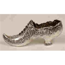 A Continental Silver Shoe, embossed flowers, import marks for London 1899, 11 cm  See illustratio...