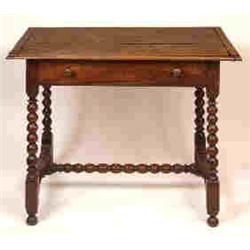 An Early 18th Century Oak Table, fitted a frieze drawer on bobbin turned supports united by an H-...