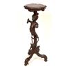 A Continental Carved Wood Jardinière Stand, on a figural column and tripod base,   See illustrati...