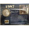 Image 1 : 1987 AMERICAN SILVER EAGLE (UNC) AND STAMP ON CARD