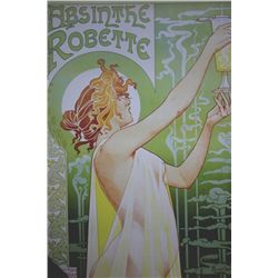 Woman holding up a glass of absinthe