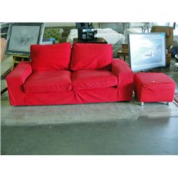 Red ikea sofa with matching footstool