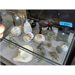 Showcase of assorted vintage collectabels