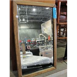 Solid oak framed bevelled wall mirror