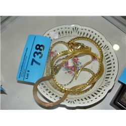 Bowl full of gold plated jewelery