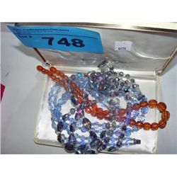 Box of costume jewelry necklaces