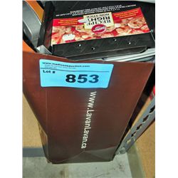 Brown bag full of new baking pans and accessories