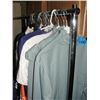 Image 1 : Entire clothing rack filled with assorted shirts