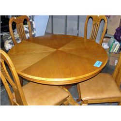 Single pedastol round oak dining table with