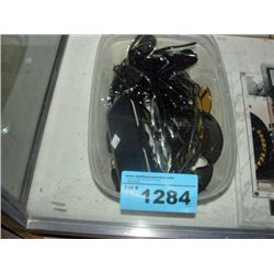 Clear plastic storage bin of assorted sunglasses