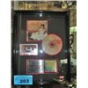 Image 1 : Framed presentation piece to Kim Blake from