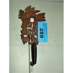 Tiny wood crafted black forest style cookoo clock