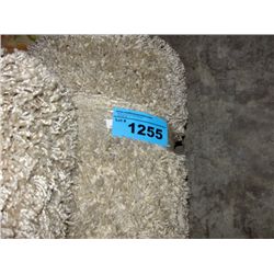 Small off white shag area rug