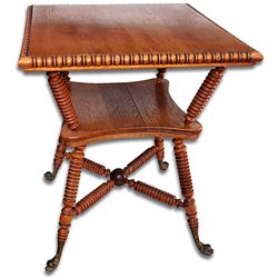 Solid oak fancy parlor table with metal serpent feet