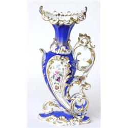 A DECORATIVE 19TH CENTURY PORCELAIN CORNUCOPIA SHAPED VASE: having  hand painted rococo panels of...
