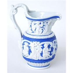 A VICTORIAN MOULDED STONEWARE MASKHEAD JUG: with ornate rustic goats  head mask handle, having a...