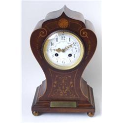 AN EDWARDIAN INLAID MAHOGANY MANTLE CLOCK: with French eight day  movement striking to gong, the...