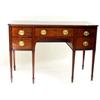 Image 1 : A EARLY 19TH CENTURY MAHOGANY SIDEBOARD: the top shaped to front,  over a central long drawer div...
