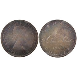 1963 $1 PCGS MS65.  Attractively toned with full original lustre.  Lovely example.