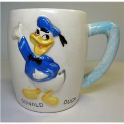 Vintage 1961 Walt Disney Donald Duck Cup. Blue handle, signed on bottom,