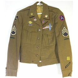 WWII ARMY JACKET COMPLETE WITH ALL INSIGNIA AND BUTTONS. DOG TAGS INCLUDED.