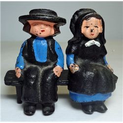 Cast Iron Amish Boy and Girl Sitting on a Bench.