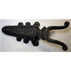 Vintage Cast Iron Boot Jack in the shape of a beetle.