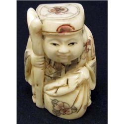 5574 -  JAPANESE BONE NETSUKE HAPPY MAN HOLDING BAG