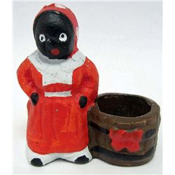 5596 - CAST IRON BLACK AMERICANA WOMAN WITH BASKET