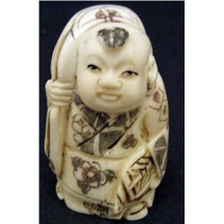 5580 -  JAPANESE OX  BONE NETSUKE HAPPY BOY CARRYING BAG
