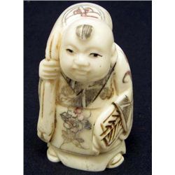 5581 -  JAPANESE OX  BONE NETSUKE HAPPY BOY CARRYING BAG