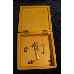 320. "Lemon" Wood Jewelry Box with Gold-filled Key Pin (missing pin backs); Pen cap, clasp, Light bu