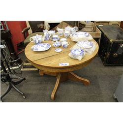 ROUND SOLID OAK TABLE WITH SQUARE CENTRAL PEDESTAL ATTACHED TO 4 SCTOLLED LEGS