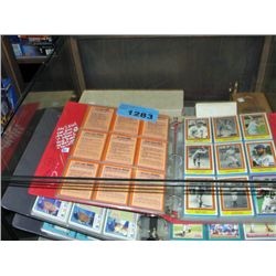 Showcase filled with assorted sports cards, albums