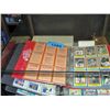 Image 1 : Showcase filled with assorted sports cards, albums