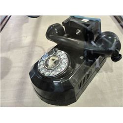 Vintage black bakelight rotary telephone with