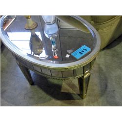 Oval shaped mirror topped coffee table