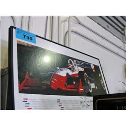 Framed formula1 racing photo, signed by driver